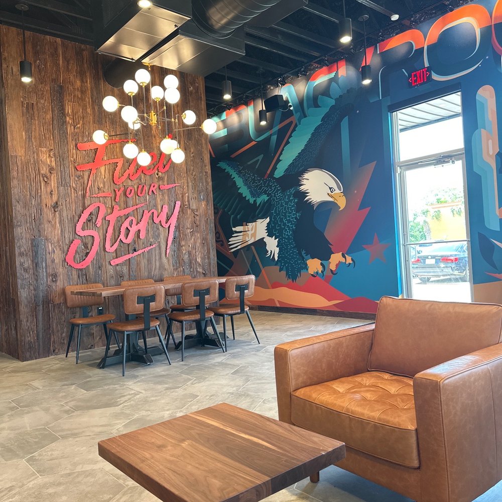 Black Rock Coffee Bar - One entry, feature wall, mural, and hallway leading to bathroom. - Coffee & Tea Near Me - Pasadena, Texas Black Rock Coffee Bar - One entry, feature wall, mural, and hallway leading to bathroom. - Coffee & Tea Near Me - Pasadena, Texas