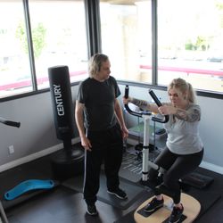 Healing Hands Spa and Wellness - Our Personal Trainer, Dan, Guiding His Client With Squats.