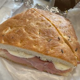 Focaccia + Mortadella + Prosciutto + Fresh Mozzarella + Sundried tomatoes + Pesto cream Focaccia + Mortadella + Prosciutto + Fresh Mozzarella + Sundried tomatoes + Pesto cream