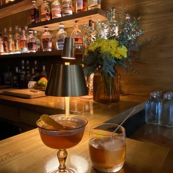 Radish & Rye - a bar with liquor bottles - New American Near Me - Santa Fe, New Mexico
