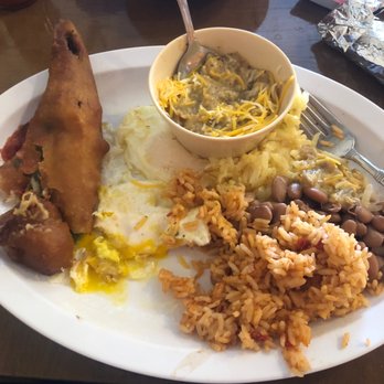 Ranch House Grille - Chile Relleno with sauce on the side, hash brown, rice and beans with over easy eggs - Breakfast & Brunch Near Me - Page, Arizona Ranch House Grille - Chile Relleno with sauce on the side, hash brown, rice and beans with over easy eggs - Breakfast & Brunch Near Me - Page, Arizona