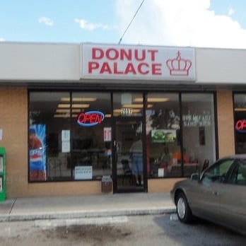 Donut Palace - a car parked in front of a donut palace - Coffee & Tea Near Me - Winter Haven, Florida