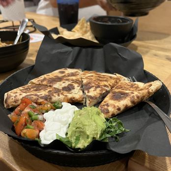 Fusion Eats - a plate of food on a table - Tacos Near Me - Houston, Texas Fusion Eats - a plate of food on a table - Tacos Near Me - Houston, Texas