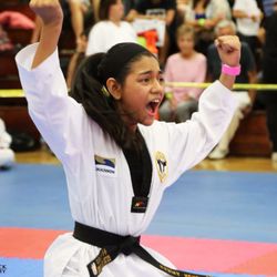 Golden Tigers Taekwondo - Ms. Karina Nunez during competition taking 1st place