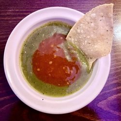 The world's best chips! She makes them to order and they are so delicate, delicious and crispy. I love the two salsas mixed.