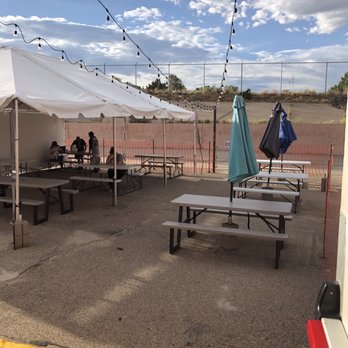 Brew Lab 101 - a group of people sitting at picnic tables - Breweries Near Me - Rio Rancho, New Mexico