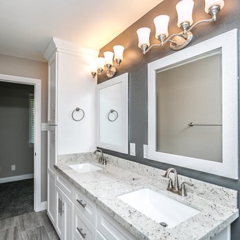 Ignite Construction - a bathroom with two sinks and mirrors - General Contractors Near Me Ignite Construction - a bathroom with two sinks and mirrors - General Contractors Near Me