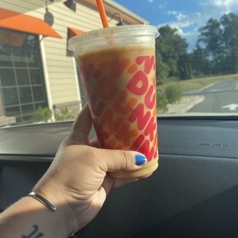 Dunkin' -  a hand holding a cup of iced coffee - Coffee & Tea Near Me - Plainville, Connecticut