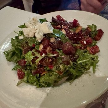 The Capital Grille - Roasted Beet and Goat Cheese Salad with Crushed Pistachios and Citrus Vinaigrette - Steakhouses Near Me - Livonia, Michigan