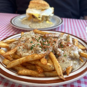 Pine State Biscuits - Cajun Fries with Gravy Reggie in the back - Breakfast & Brunch Near Me - Portland, Oregon