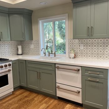 Bella Kitchen Bath Flooring - a kitchen with green cabinets and white appliances - Kitchen & Bath Near Me - Mission Viejo, California Bella Kitchen Bath Flooring - a kitchen with green cabinets and white appliances - Kitchen & Bath Near Me - Mission Viejo, California