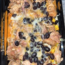 Loco Taco - Pork bowl: Pork, lettuce, seasoned white rice, tomatoes, cheese, corn, black beans, doritos, and creamy chipotle sauce