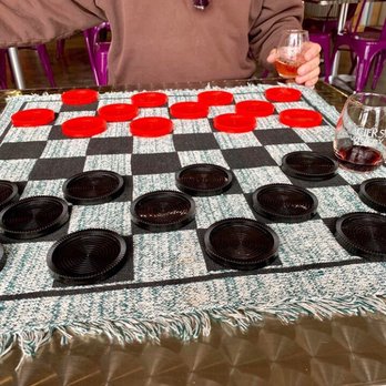 Glacier Sun Winery & Tasting Room - Giant checkers. We enjoyed playing games while enjoying the wines. - Wineries Near Me - Kalispell, Montana