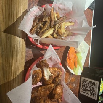 Pounders Bar & Grill - Tasty juicy wings in a dry rub Cajun coating with a side of habanero sauce. - Bars Near Me - Cleveland, Ohio Pounders Bar & Grill - Tasty juicy wings in a dry rub Cajun coating with a side of habanero sauce. - Bars Near Me - Cleveland, Ohio
