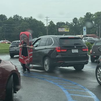 7 Brew Coffee - 7brew staff taking an order from a car in the rain while wearing a hilarious protective thing - Coffee & Tea Near Me - Lenoir City, Tennessee 7 Brew Coffee - 7brew staff taking an order from a car in the rain while wearing a hilarious protective thing - Coffee & Tea Near Me - Lenoir City, Tennessee