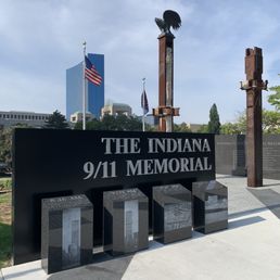 The timeline of 9/11 events with 2 beams from the New York World Trade Center buildings in the background.