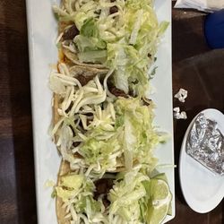 La Gran Fiesta Mexican Restaurant - Traditional tacos with added lettuce and cheese