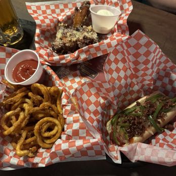 Nunya Neighborhood Bar - Regulation Hot dog (iykyk), curly fries, and garlic parm wings. - Sports Bars Near Me - Austin, Texas Nunya Neighborhood Bar - Regulation Hot dog (iykyk), curly fries, and garlic parm wings. - Sports Bars Near Me - Austin, Texas