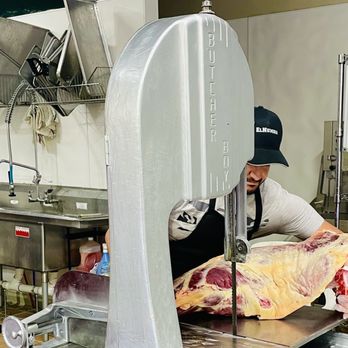El-Numidia Halal Market - a butcher cutting meat - International Grocery Near Me - Bristol, Connecticut El-Numidia Halal Market - a butcher cutting meat - International Grocery Near Me - Bristol, Connecticut