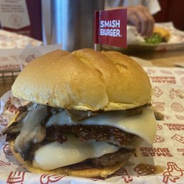 a cheeseburger with onions and cheese