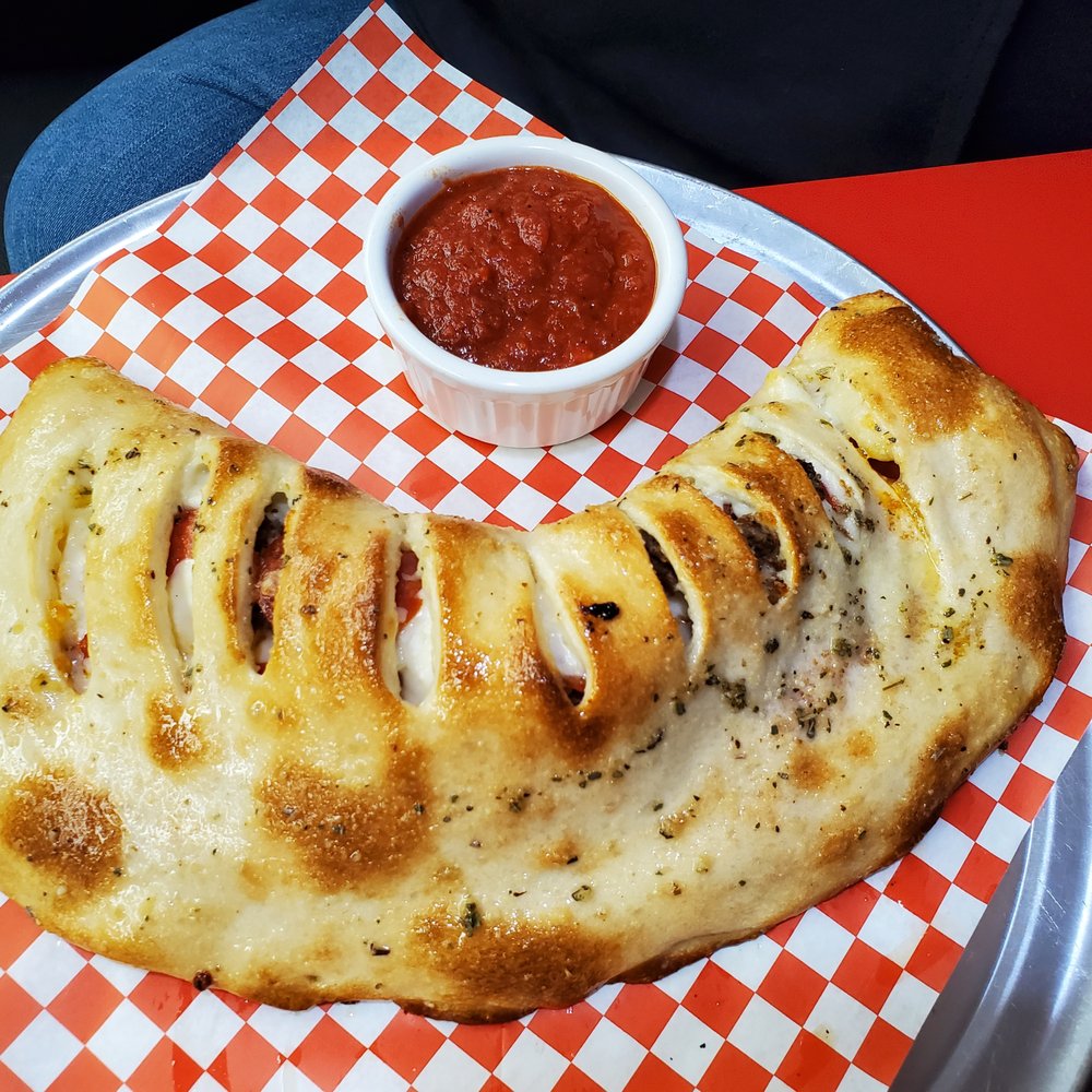 Graziano's Pizzaria - Huge calzone. Photo doesn't do it justice - Pizza Near Me - Oceanside, California Graziano's Pizzaria - Huge calzone. Photo doesn't do it justice - Pizza Near Me - Oceanside, California
