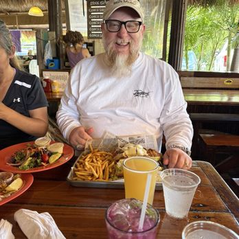 Hogfish Bar & Grill - Happy hogfish sandwich - Seafood Near Me - Stock Island, Florida Hogfish Bar & Grill - Happy hogfish sandwich - Seafood Near Me - Stock Island, Florida