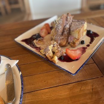 Coastal Orange Beach - Stuffed French toast with blueberries and raspberry drizzle - Seafood Near Me - Orange Beach, Alabama Coastal Orange Beach - Stuffed French toast with blueberries and raspberry drizzle - Seafood Near Me - Orange Beach, Alabama