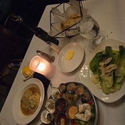 Seafood tower for two, Cesar salad, and ravioli Seafood tower for two, Cesar salad, and ravioli