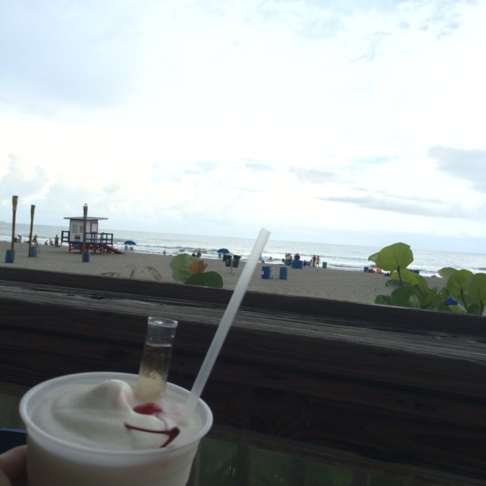Coconuts On The Beach - Enjoying a piña colds right on the beach - Bars Near Me - Cocoa Beach, Florida