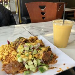 Afra Grill | African & Somali Cuisine - Jollof rice, lamb, mixed veggies, corn, plantains, and kachumbari, with Afra fantastic sauce