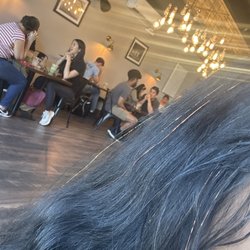 Sparkle Squad - Orange sparkles on black hair.