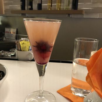 Kafe Leopold - P&C cocktail. Peach purée, champagne, and hibiscus - Austrian Near Me - Washington, DC, District of Columbia