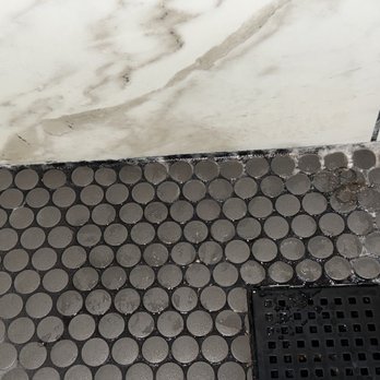 Azores Kitchen & Bath Remodeling - this shows the constant wet floor and mineral deposits that couldnt be removed from the water leak they left for months. - Flooring Near Me - Frisco, Texas