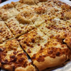 Bertoglio's Pizza - Italian cheese bread (like a flatbread with cheese and lots of air bubbles)