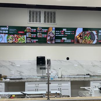Suya Outpost - Menu on top with different choices of bowl, burrito, sandwich or plate. - African Near Me - Humble, Texas Suya Outpost - Menu on top with different choices of bowl, burrito, sandwich or plate. - African Near Me - Humble, Texas