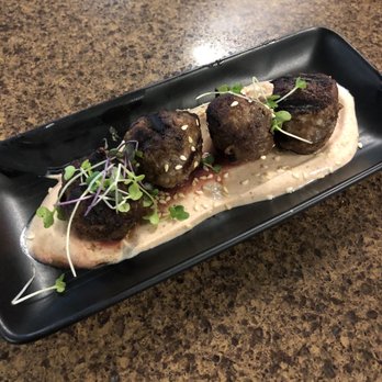 Cat Cora's Kitchen - Lamb meatballs. The picture doesn't do it justice. $11 for four of the best bites you'll ever have in an airport - New American Near Me - San Francisco, California