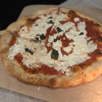 Beneci's D'Italia Cucina - a pizza on a table - Italian Near Me - Weehawken, New Jersey Beneci's D'Italia Cucina - a pizza on a table - Italian Near Me - Weehawken, New Jersey