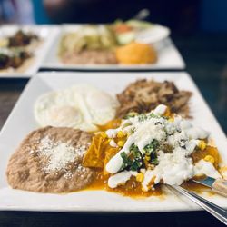 Chile Caliente Tacos Y Mariscos - Flor de Calabaza Chilaquiles with Carnitas and Eggs Over-Easy