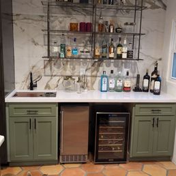 We did a new floor and stone backsplash to our kitchen bar.