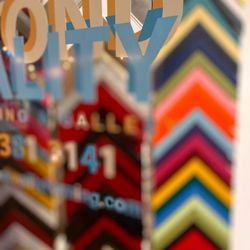Beyond Reality Framing & Gallery - Some of the colorful framing options available at Beyond Reality Framing & Gallery upstairs inside The Arts Factory.