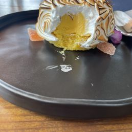 Melon bombe with custard and cake exposed Melon bombe with custard and cake exposed