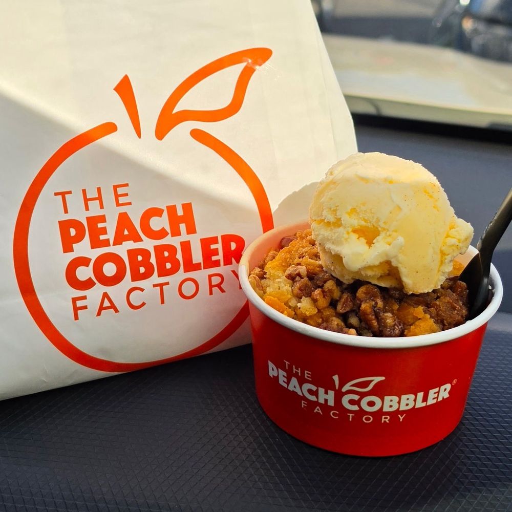 Peach Cobbler Factory - Sweet potato, pecan praline, and bourbon pecans was add and of course vanilla ice cream - Desserts Near Me - Round Rock, Texas