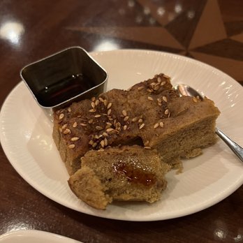 Tiffins Restaurant - Complimentary bread - pomegranate focaccia served with molasses and olive oil - New American Near Me - Lake Buena Vista, Florida Tiffins Restaurant - Complimentary bread - pomegranate focaccia served with molasses and olive oil - New American Near Me - Lake Buena Vista, Florida