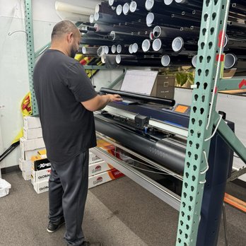 Fonzy's Tint - Fonzy working to customize the tint print. - Car Window Tinting Near Me - Redlands, California Fonzy's Tint - Fonzy working to customize the tint print. - Car Window Tinting Near Me - Redlands, California