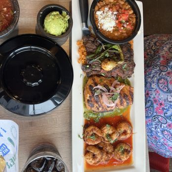 Fat Rosie's - MARY TIERRA Grilled Alaskan salmon, garlic shrimp, and skirt steak. Served with Mexican rice, charro beans, guacamole, and sour cream - Mexican Near Me - Oak Brook, Illinois