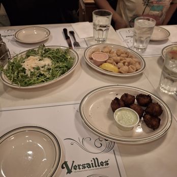 Versailles - Arugula salad, calamari (taste fresh, could have been a bit more fried for.a better crunch) and cod fish fritters - Cuban Near Me - Miami, Florida