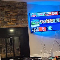 FixTman - Washington - 55in Samsung TV mounted to Sanus full motion mount