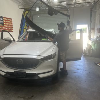 Wisecrack Auto Glass - Luis taking off the old windshield - Auto Glass Services Near Me - Tucson, Arizona Wisecrack Auto Glass - Luis taking off the old windshield - Auto Glass Services Near Me - Tucson, Arizona