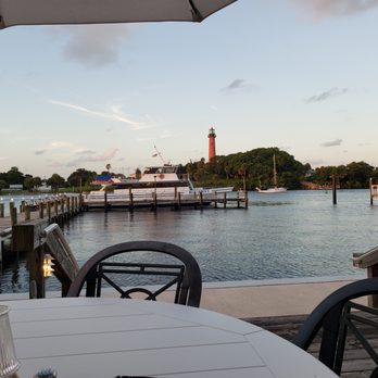 Jetty's Waterfront Restaurant - a view of a dock and a lighthouse - Seafood Near Me - Jupiter, Florida Jetty's Waterfront Restaurant - a view of a dock and a lighthouse - Seafood Near Me - Jupiter, Florida