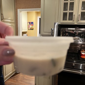 Basil Thai - a person holding a bowl in a kitchen - Thai Near Me - Blue Ash, Ohio Basil Thai - a person holding a bowl in a kitchen - Thai Near Me - Blue Ash, Ohio